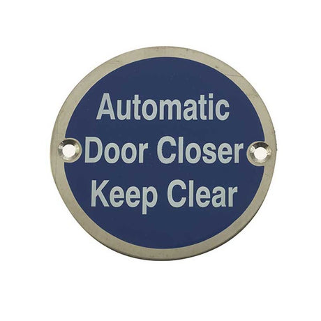 This is an image showing the Frelan - Automatic Door Closer Keep Clear - Signage 75mm Dia. - Satin Stainless available to order from T.H. Wiggans Ironmongery in Kendal