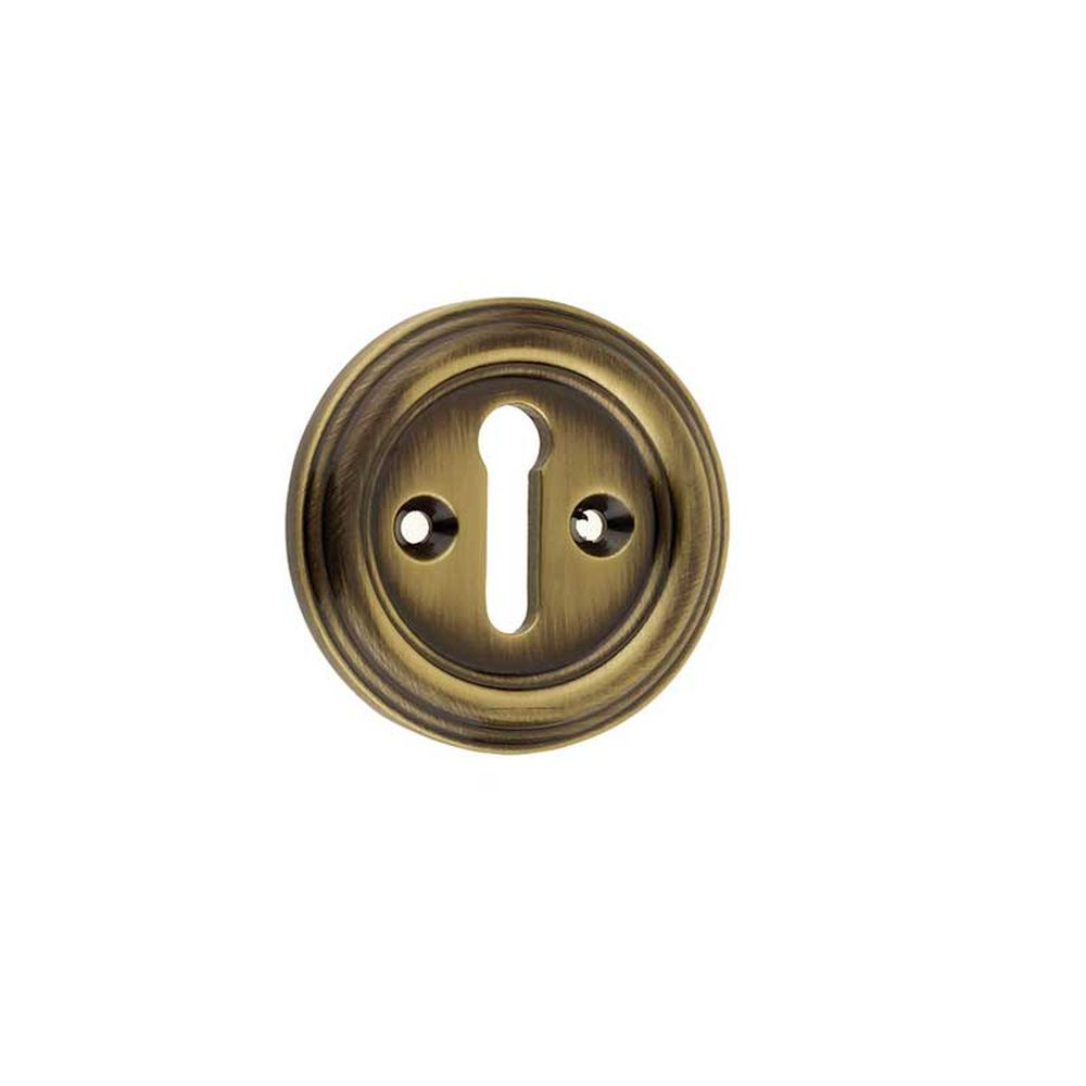 This is an image showing the Frelan - Parisian Standard Key Escutcheon - Antique Brass available to order from T.H. Wiggans Ironmongery in Kendal