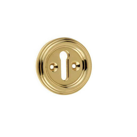 This is an image showing the Frelan - Parisian Standard Key Escutcheon - Polished Brass available to order from T.H. Wiggans Ironmongery in Kendal