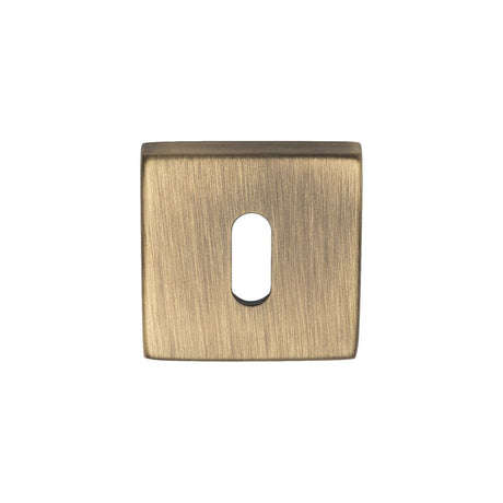 This is an image of Manital - Square Standard Key Escutcheon - Antique Brass available to order from T.H Wiggans Architectural Ironmongery in Kendal, quick delivery and discounted prices.