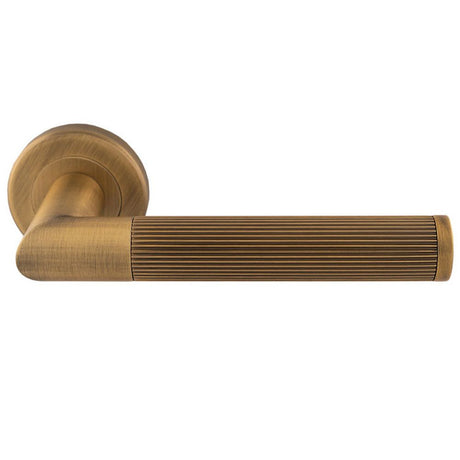 This is an image of Serozzetta - Trend Lines Lever On rose - Antique Brass available to order from T.H Wiggans Architectural Ironmongery in Kendal, quick delivery and discounted prices.