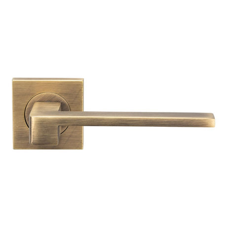 This is an image of Serozzetta - Equi Lever on Square Rose - Antique Brass available to order from T.H Wiggans Architectural Ironmongery in Kendal, quick delivery and discounted prices.